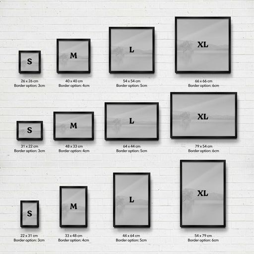 Set of photo frames with dimensions and border options on a white brick wall background